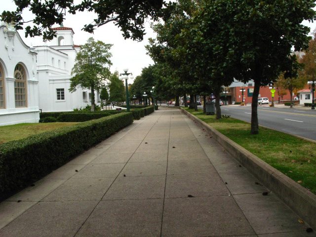 Tree-lined sidewalk along Bathhouse Row in Hot Springs, AR